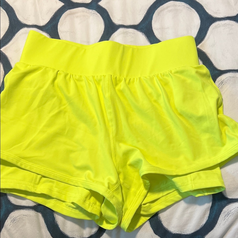 Fabletics Neon Yellow Athletic Shorts with pockets